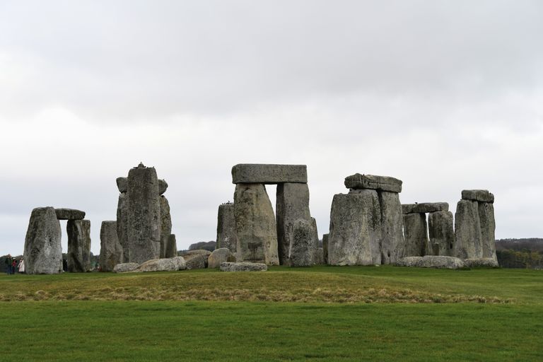 Stunning daytime photo of Stonehenge with cloudy skies above, capturing its ancient grandeur.